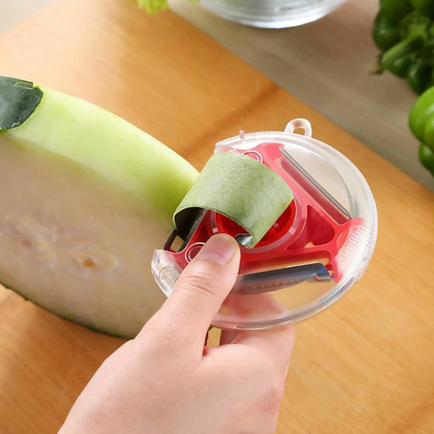 Three in One Vegetable Peeler for Peeling, Shredding and Slicing with a Blade Cover and Finger Guard